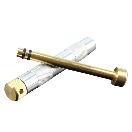 Portable Compression Fire Tube Metal Fire Starting Tool.